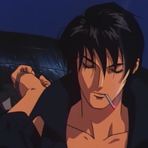 Riki holds his jacket that is slung over one shoulder, eyelids closed and cigarette between his lips.